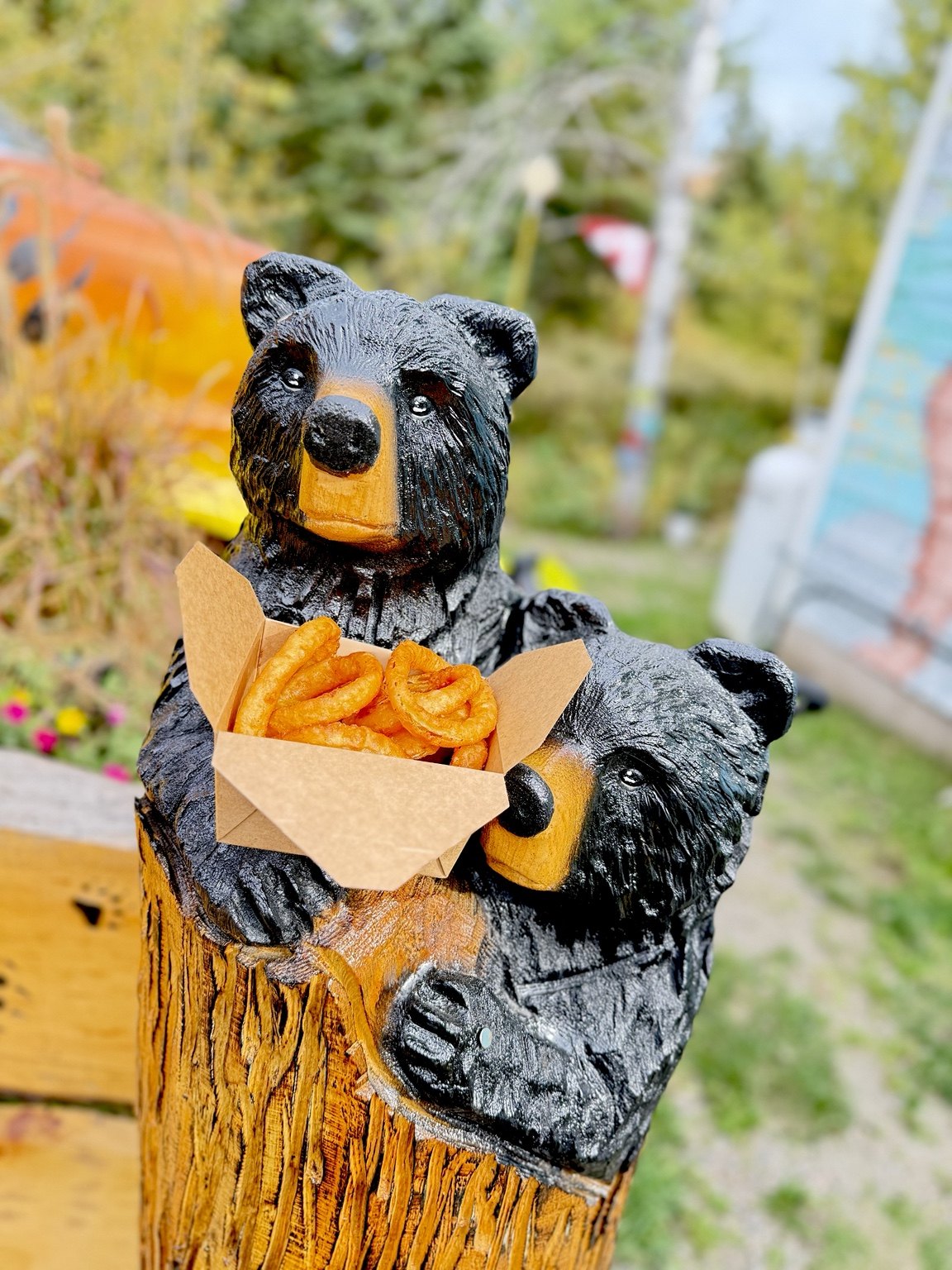 The Bear’s Den bear statues with a serving of onion rings
